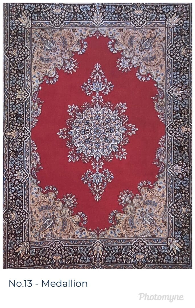 A red rug with a large floral design.
