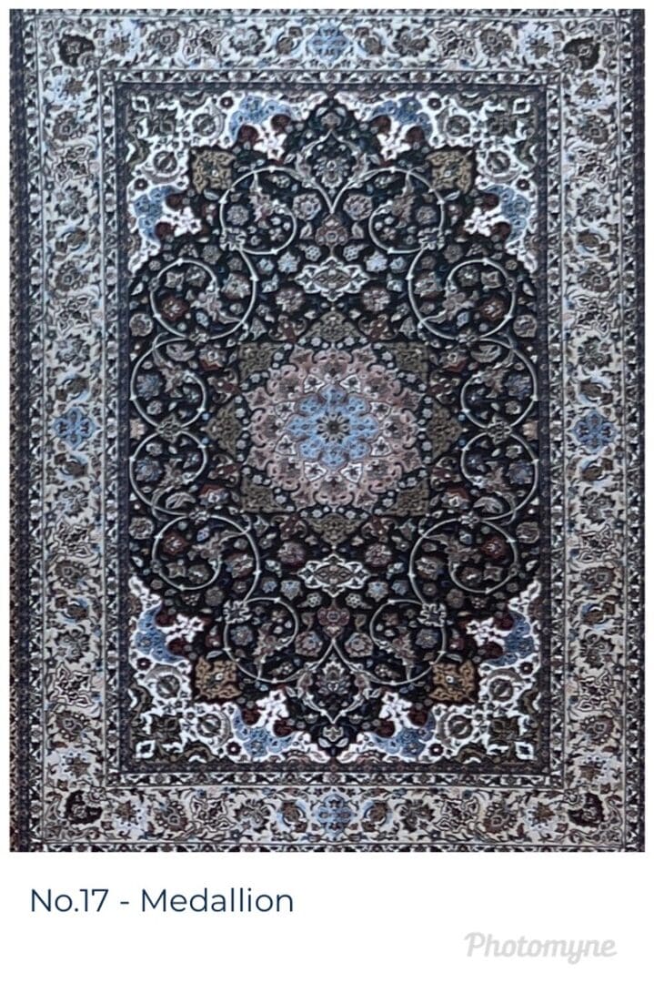 A large rug with a floral design in shades of blue and grey.