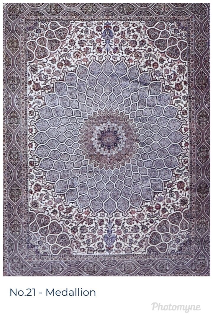 A large rug with a floral design in shades of blue and brown.