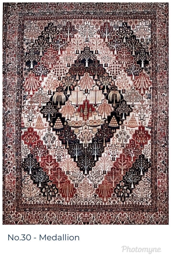 A rug with an intricate design in shades of red, black and white.