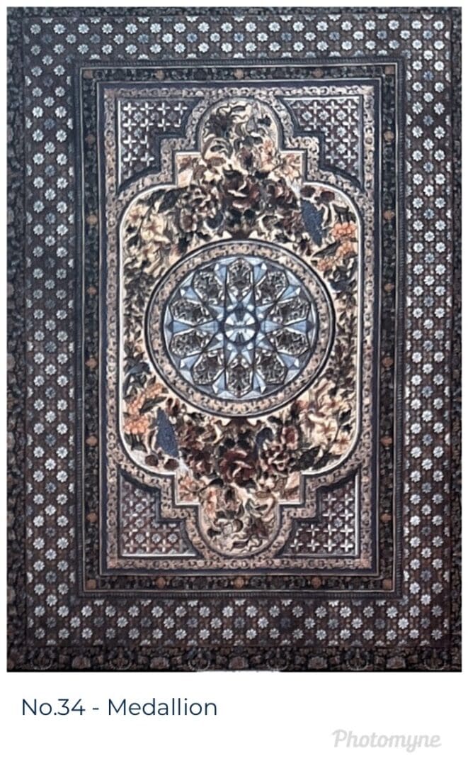 A picture of an ornate carpet with intricate designs.