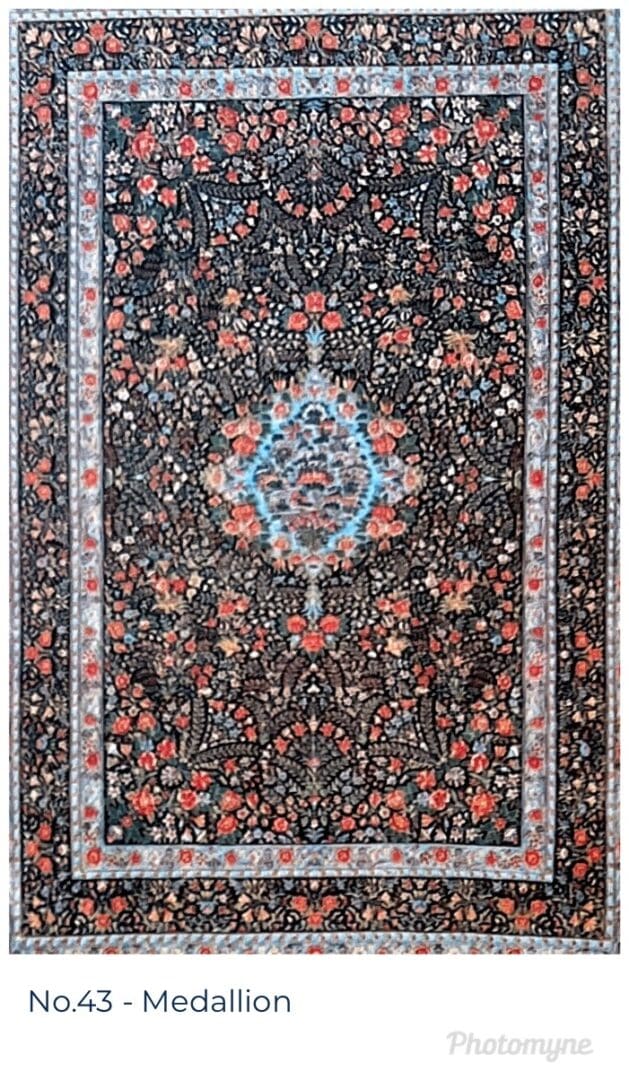 A rug with red and blue flowers on it.