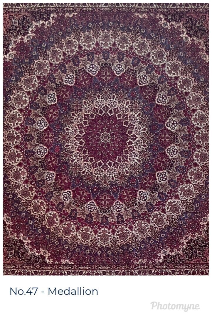 A large purple and white mandala with many designs.