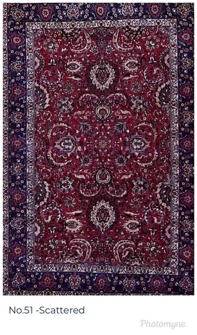 A red and blue rug with floral design