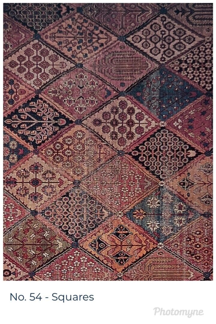 A large rug with various designs of different colors.